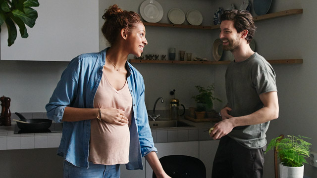 Pregnant couple in kitchen 2 SMALL