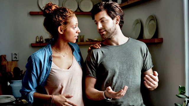 Couple home talking.