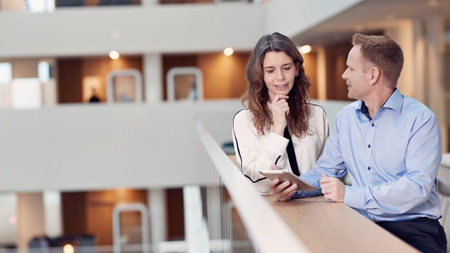 couple talking in office small overlay