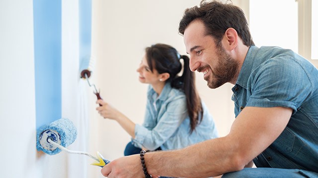 Housing-painting-smiling-couple-small