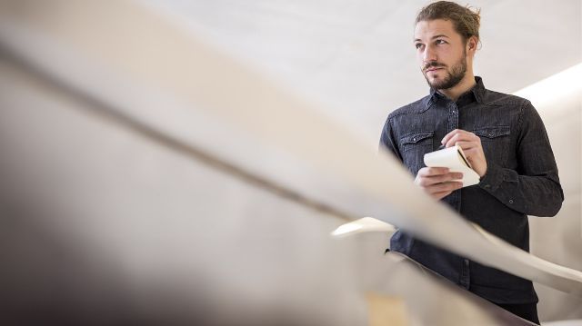young-man-with-writing-pad-small