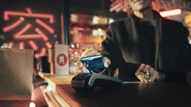 Woman-makes-mobile-payment SMALL