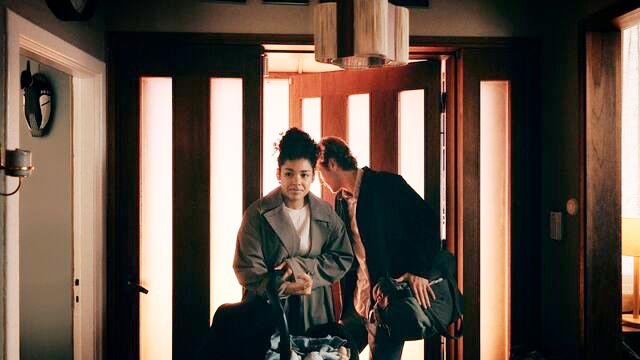 Young-couple-coming-home-with-new-born-baby-in-the-hallway-small