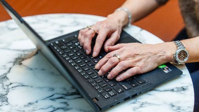 hands-working-on-computer-small